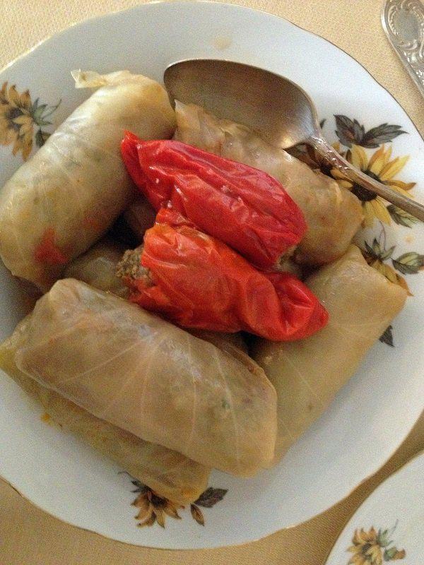 STUFFED CABBAGE IN PLATE WITH RED PEPPERS